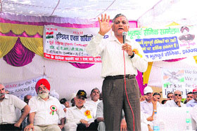 Former Army Chief VK Singh addresses retired defence personnel at a village in Jhajjar district on Sunday. 