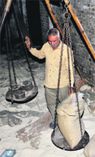 A worker at a store of the Consumer Affairs and Public Distribution Department in Jammu.