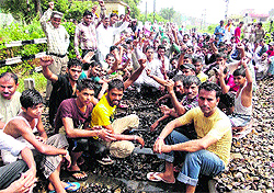 BSP activists sit on a dharna on the rail track in Phagwara on Sunday