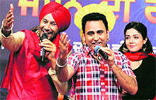 Punjabi singer and actor Harbhajan Mann, along with Sarabjit Cheema and actor Sonia Mann perform at a cultural programme during Jashan Di Raat' on the occasion of 13th anniversary of DD Punjabi in Jalandhar on Saturday night