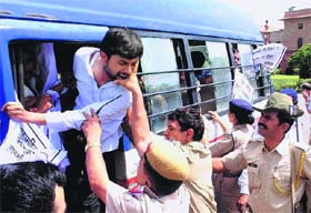 Police personnel detain RTI activists outside President house during a protest demanding the amendment to the RTI Act and Representation of the People Act in New Delhi on Sunday