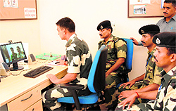 A BSF official interacts with his family in Meerut through video-conferencing at Attari on Sunday