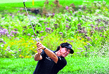 Phil Mickelson hits out of the bunker to the 18th hole during the second round of the Deutsche Bank Championship in Norton, Massachusetts, on Saturday