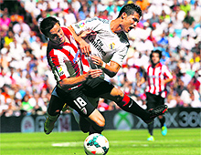 Real Madrid's Cristiano Ronaldo fights for the ball with Athletic Bilbao's Carlos Gurpegi during their Spanish first division match in Madrid on Sunday