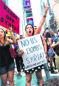 Opponents of US military action in Syria protest at New York's Times Square on Saturday.