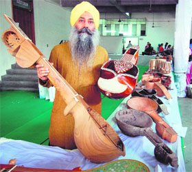 Baldeep Singh with the traditional musical instruments he has revived at GNDU on Monday. 