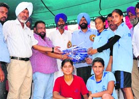 Former mayor Baljit Singh Bir Behman felicitates winners of the junior handball championship at St Xaviers Senior Secondary School in Bathinda on Monday