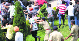 The police chases SOPU workers at the UIET on Monday.