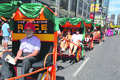 Various cultural groups representing different Indian states decorate rickshaws in their own colourful way to showcase their unique culture to people on the parade route
