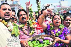 Residents of the Janipur area protest against the increase in vegetable prices in Jammu on Monday. 