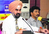 LIC Senior Divisional Manager GS Parmar addresses the media in Jalandhar on Monday. 