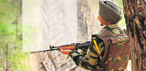 A soldier stands guard at the Line of Control. 