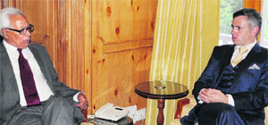 Governor NN Vohra and Chief Minister Omar Abdullah during a meeting at Raj Bhawan on Monday. 
