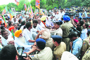 The police prevents protesting farmers from entering Chandigarh at the Zirakpur border on Monday.
