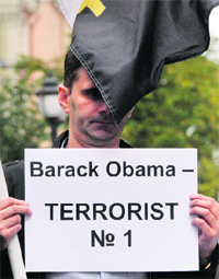 A pro-Kremlin activist takes part in a picket outside US Consulate in St. Petersburg on Monday.