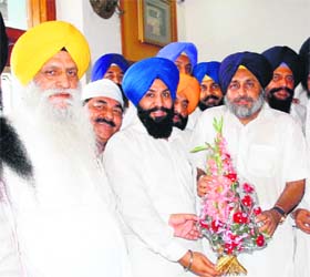 Members of the Sikh Student Federation Mehta welcome Dy CM Sukhbir Badal after his re-election as the party chief in Amritsar on Tuesday