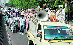 Members of the Bhullar Bhaichara carry out a protest rally in Bathinda on Tuesday