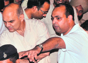 Deputy Commissioner Mohammad Shayin shows the spot to UT Adviser KK Sharma from where the boy was rescued in Sector 32. 