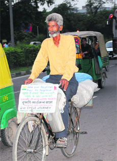 Parvesh Masih on his cycle in Chandigarh on Tuesday.