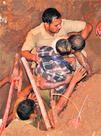  The child being rescued from the pit at Sector 32 in Chandigarh on Tuesday. 