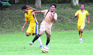A match in progress during the RIMC All-India Inter-School Soccer Cup in Dehradun on Tuesday. 
