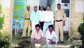 Child kidnappers in police custody at Sarkaghat in Mandi on Tuesday.