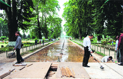 Police officials in civvies inspect the venue of Zubin Mehtas concert with metal detectors in Srinagar on Tuesday.