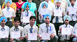 Students of Ramgarhia Senior Secondary School with their certificates after a talent hunt competition