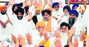 Akali delegates raise their hands to approve Deputy CM Sukhbir Badals re-election as party president in Amritsar on Tuesday.