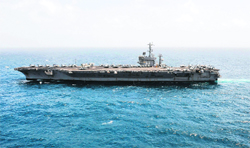 US aircraft carrier USS Nimitz (CVN 68) transiting the Arabian Sea. Nimitz and other ships in its strike group are heading west toward the Red Sea to help support a limited US strike on Syria, if needed.