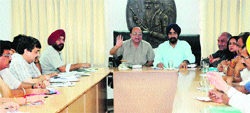 Mayor Bakshi Ram Arora interacts with officials at a meeting in Amritsar on Wednesday. Photo: Vishal Kumar