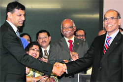 New RBI Governor Raghuram Govind Rajan takes charge from his predecessor D Subbarao at the RBI headquarters in Mumbai on Wednesday.  PTI