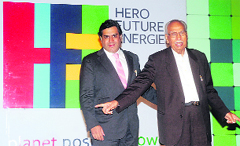 Hero Group chairman Dr Brijmohan Lall Munjal with Rahul Munjal (L) at the launch of new business unit, Hero Future Energies, in New Delhi on Wednesday. Tribune photo: Manas Ranjan Bhui