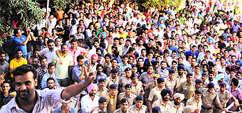 Chandan Rana, president of the Panjab University Campus Student Council, flashes a victory sign on Wednesday