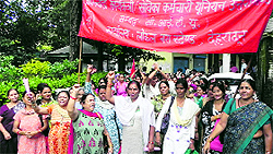 Anganwari workers hold a protest demonstration in support of their demands at the office of the District Magistrate in Dehradun on Wednesday