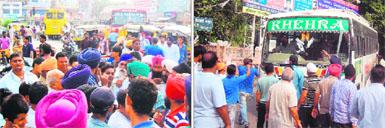 Shopkeepers near the bus stand stage a protest against bus operators for blowing pressure horns. 