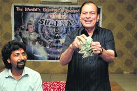 Renowned magician Samrat Shankar shows a magic trick during an interaction with mediapersons in Bathinda on Thursday