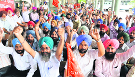 CTU workers hold protest at the ISBT, Sector 17, in Chandigarh on Friday.