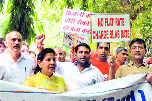 Members of the Gurgaon Citizens Council protest the hike in power tariff in Gurgaon on Thursday.
