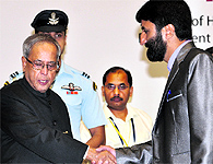 Mohammad Yaqub and Waheeda Chowdhary with President Pranab Mukherjee during the awards ceremony at Vigyan Bhawan in New Delhi on Thursday