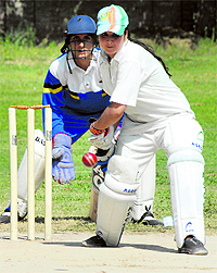 A batswoman tries to play a stroke during a cricket match between Budgam and Pulwama districts at Government Womens Degree College, M A Road, Srinagar, on Thursday. The U-19 cricket tournament is organised by the District Youth Sports and Services Association for college-going students