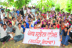 Students of various colleges hold a protest under the banner of Punjab Students Union (Shaheed Randhawa) outside the Distict Administrative Complex in Bathinda on Friday.