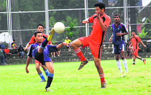 A match being played during the RIMC All India Inter-School Soccer Cup in Dehradun on Friday. 