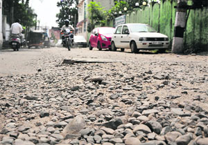 The dug-up VIP road connecting the Deputy Commissioners Office  to the Chief Ministers residence is in poor state in Jammu on Friday. 