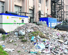 Garbage littered in the back lanes of the commercial hub of Bahu Plaza complex in Jammu. 
