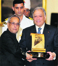 Tagore Award for zubin: President Pranab Mukherjee presents the Tagore Award for Cultural Harmony 2013 to renowned music conductor Zubin Mehta at a ceremony at Rashtrapati Bhawan in New Delhi on Friday.