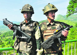 BSF men with Italian Beretta CX-4 carbine (left) and Israeli X-95 assault rifle at the LoC. 