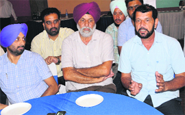 Private bus operators address a press conference in Bathinda on Saturday.