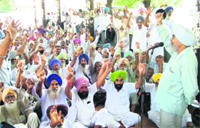Members of the PRTC Pensioners Association stage a rally at the bus stand