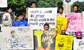Holding paintings and sketches, students of the Government College of Art, Sector 10, protest at the Sector 17 Plaza in Chandigarh on Saturday.